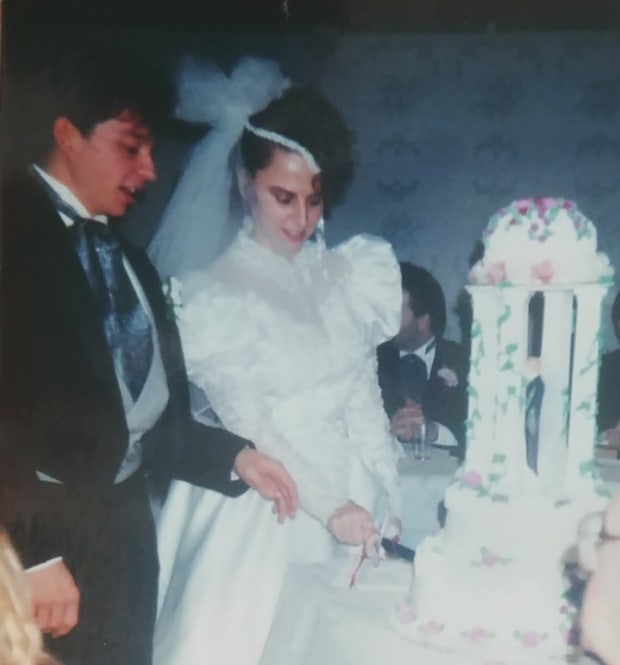 author's mother and father cutting their wedding cake ect gave me a mom