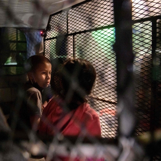 Two unaccompanied migrant children at a processing checkpoint in Roma, Texas Two unaccompanied migrant children at a processing checkpoint in Roma, Texas