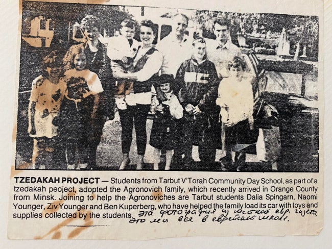 newspaper clipping of author's family welcomed to California as refugees